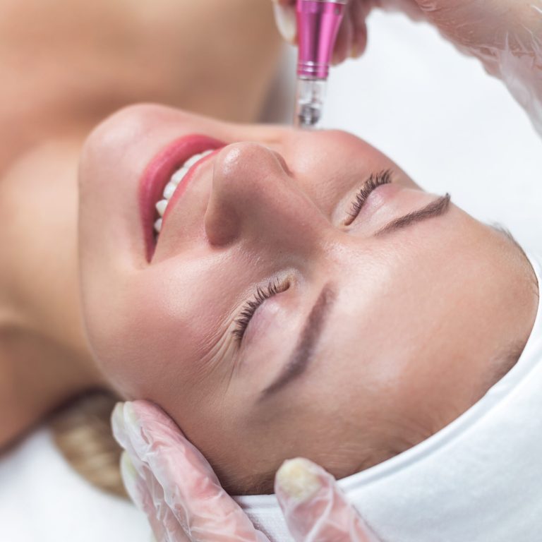Woman having facial treatment in beauty salon, closeup. Oxy derma therapy with derma pen
